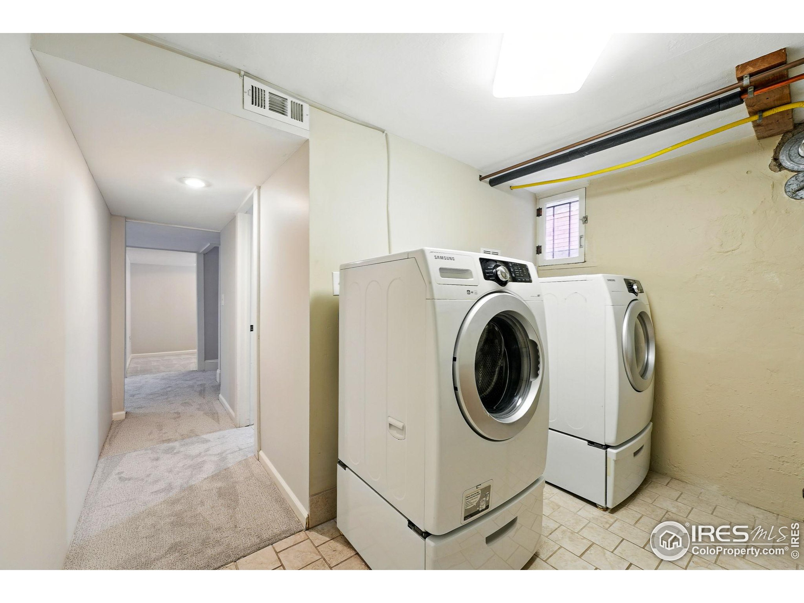 1582 Steele Street Denver, CO 80206 - Photo 42 of 48 a utility room with dryer and washer