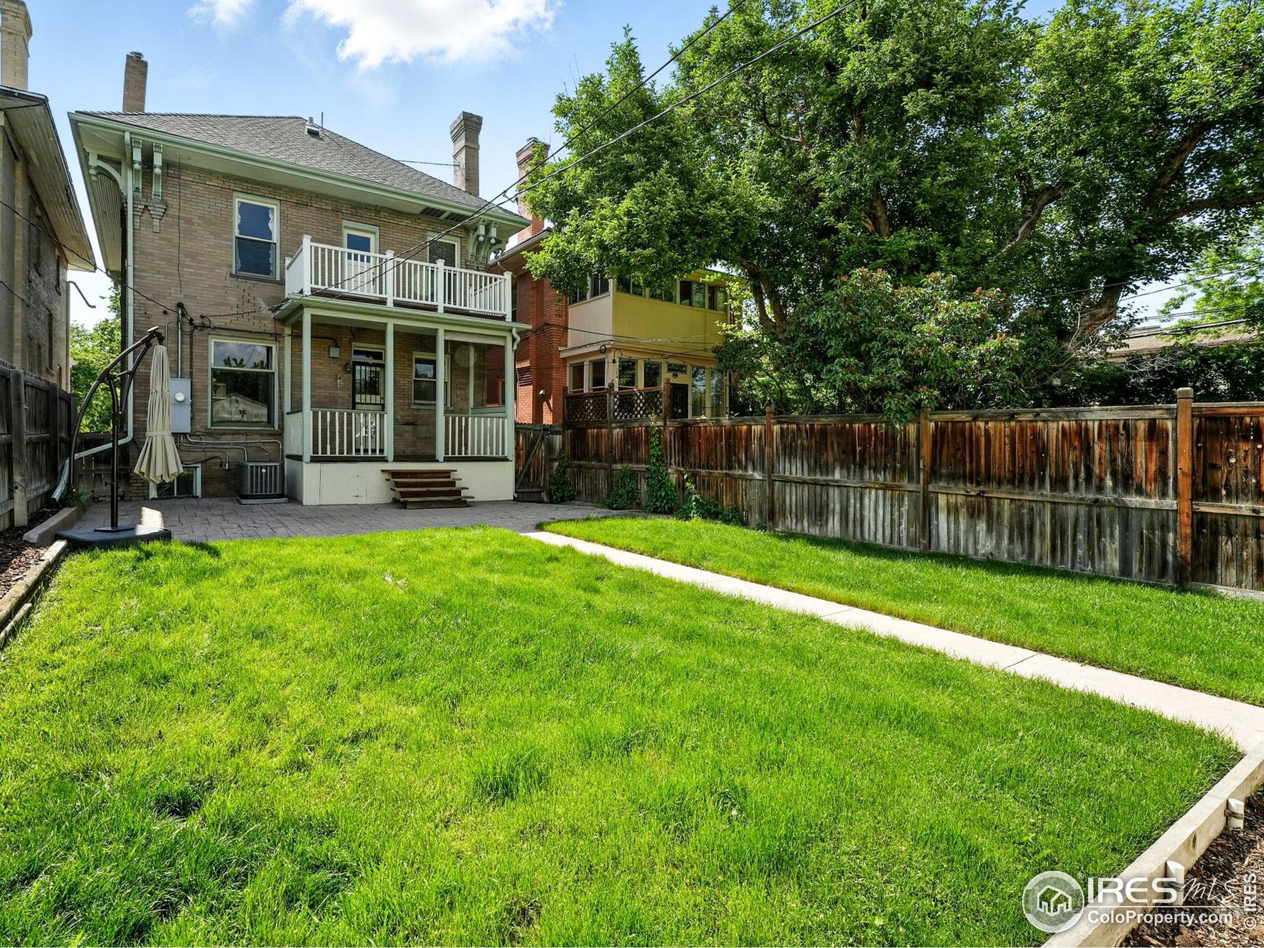 1582 Steele Street Denver, CO 80206 - Photo 43 of 48 a view of a house with a yard and sitting area