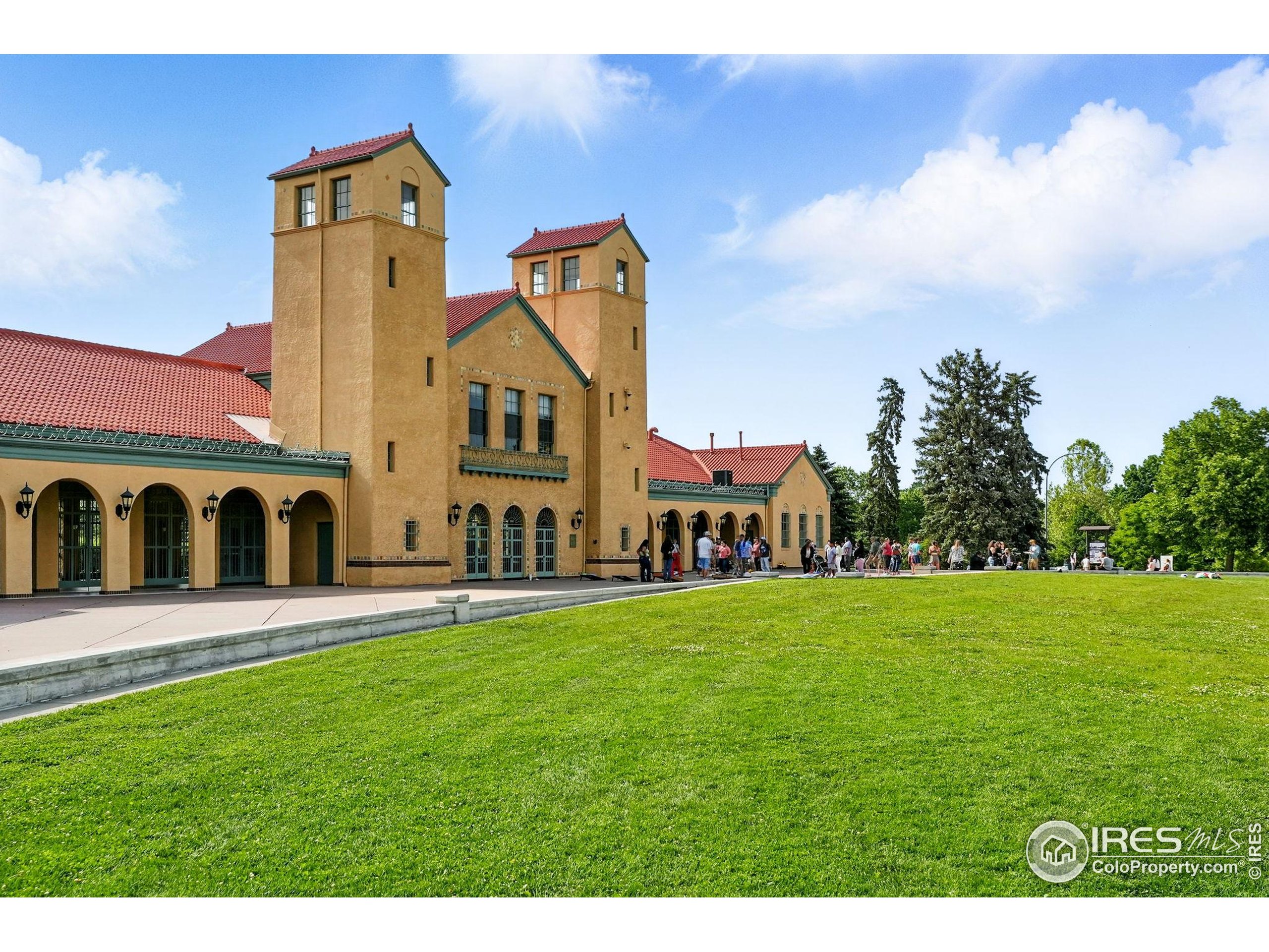 1582 Steele Street Denver, CO 80206 - Photo 46 of 48 a view of a big house with a big yard and large trees