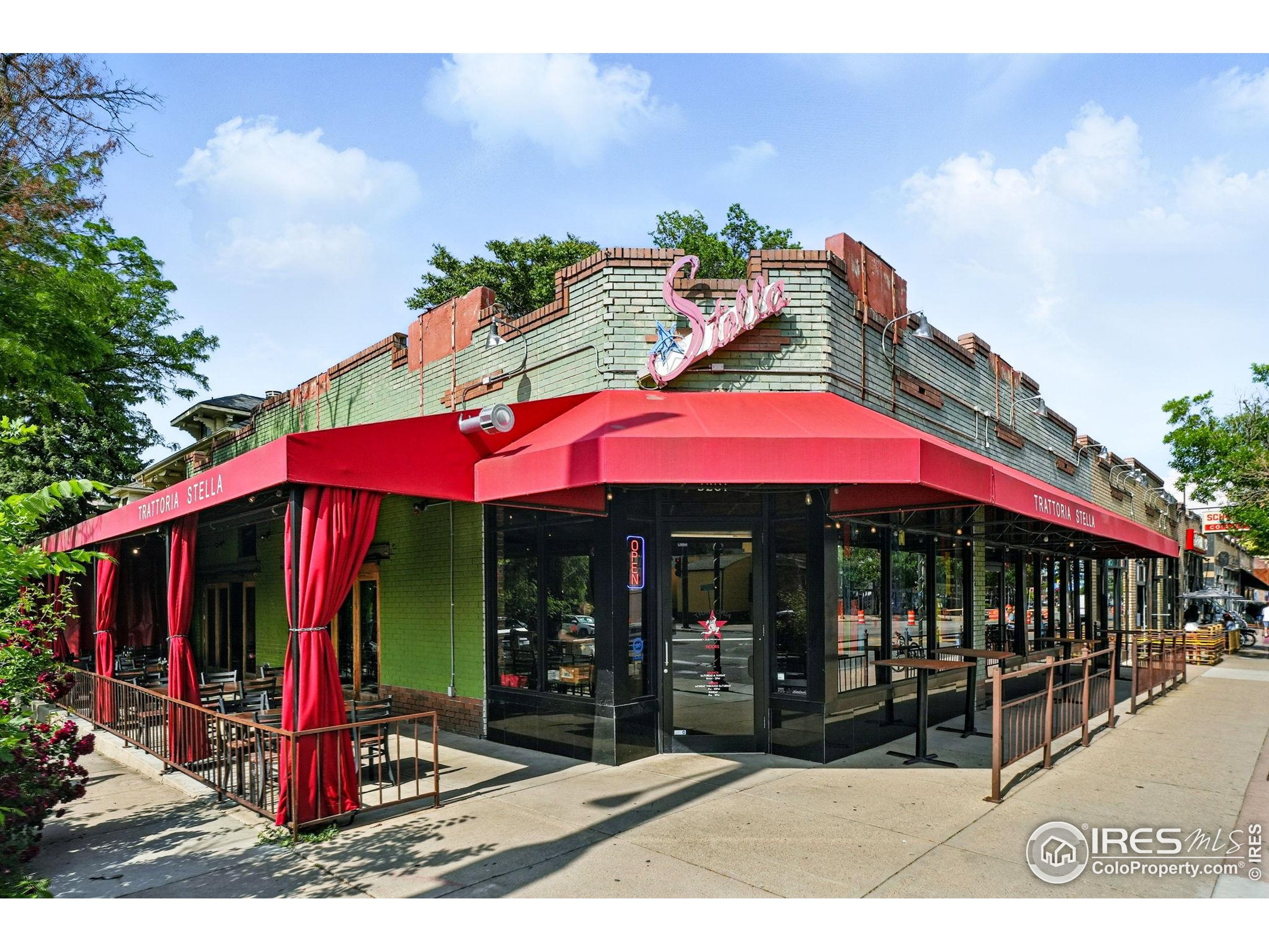 1582 Steele Street Denver, CO 80206 - Photo 48 of 48 a view of a cafe with sitting area in front of it