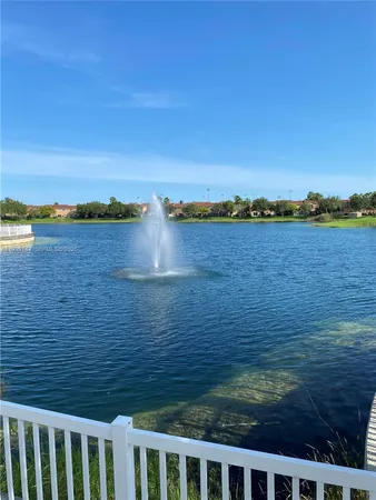 a view of a backyard and swimming pool
