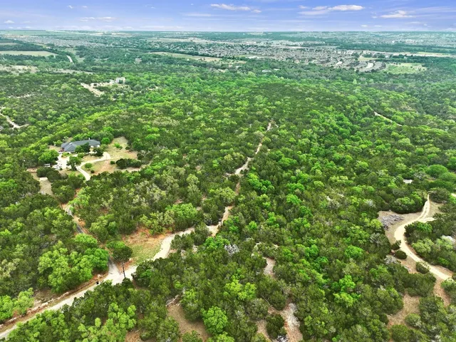 a view of a lush green space with sea