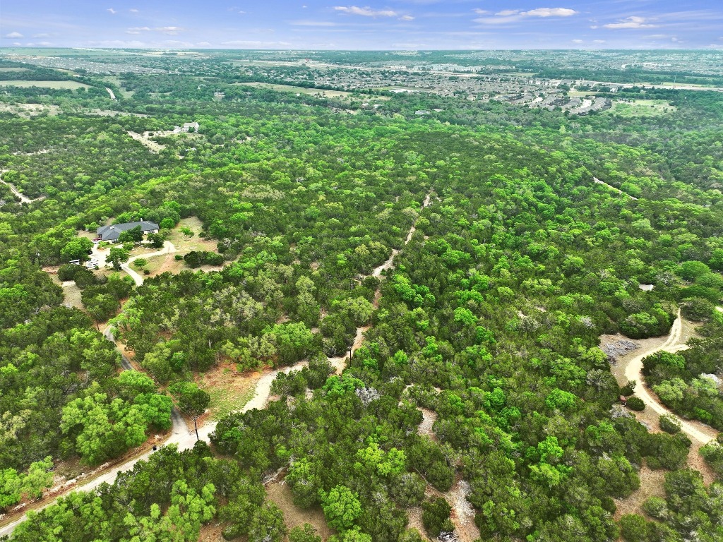 a view of a lush green space with sea