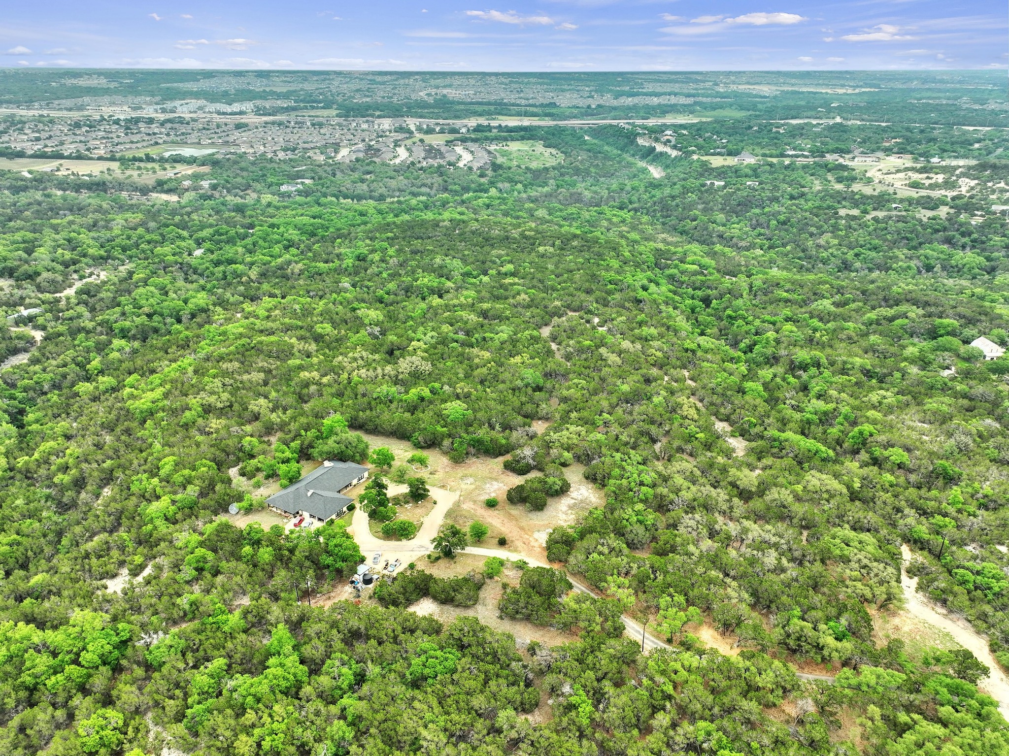 1930 Oak Grove Road Leander, TX 78641 - Photo 3 of 4 a view of a green field with lots of bushes