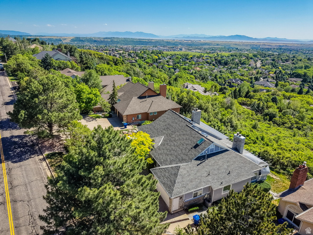 5057 South Ridgedale Drive Ogden, UT 84403 - Photo 56 of 69 Expansive property featuring a multi-level roofline, skylights, and multiple chimneys