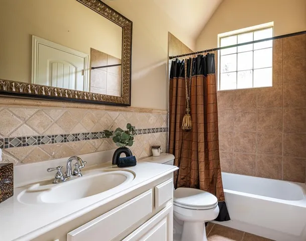 a bedroom with a bed and a walk in closet