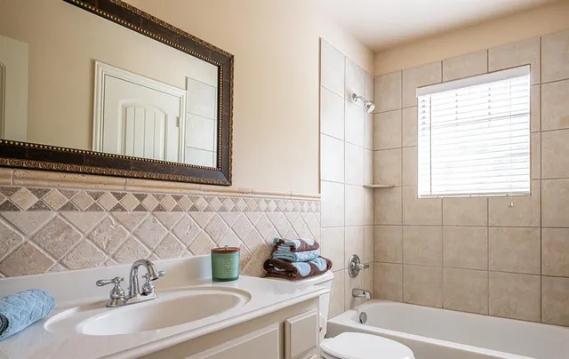 a view of a livingroom with furniture and an empty room