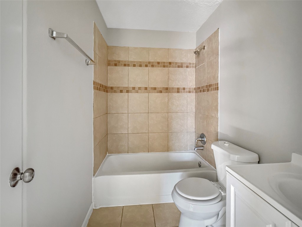 114 8th Street Rosenberg, TX 77471 - Photo 12 of 19 a bath room with a toilet and a bath tub