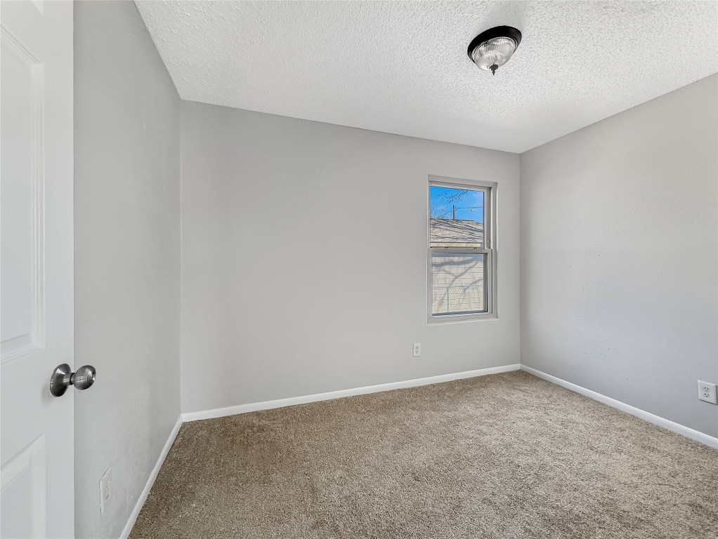 114 8th Street Rosenberg, TX 77471 - Photo 13 of 19 an empty room with a workbench