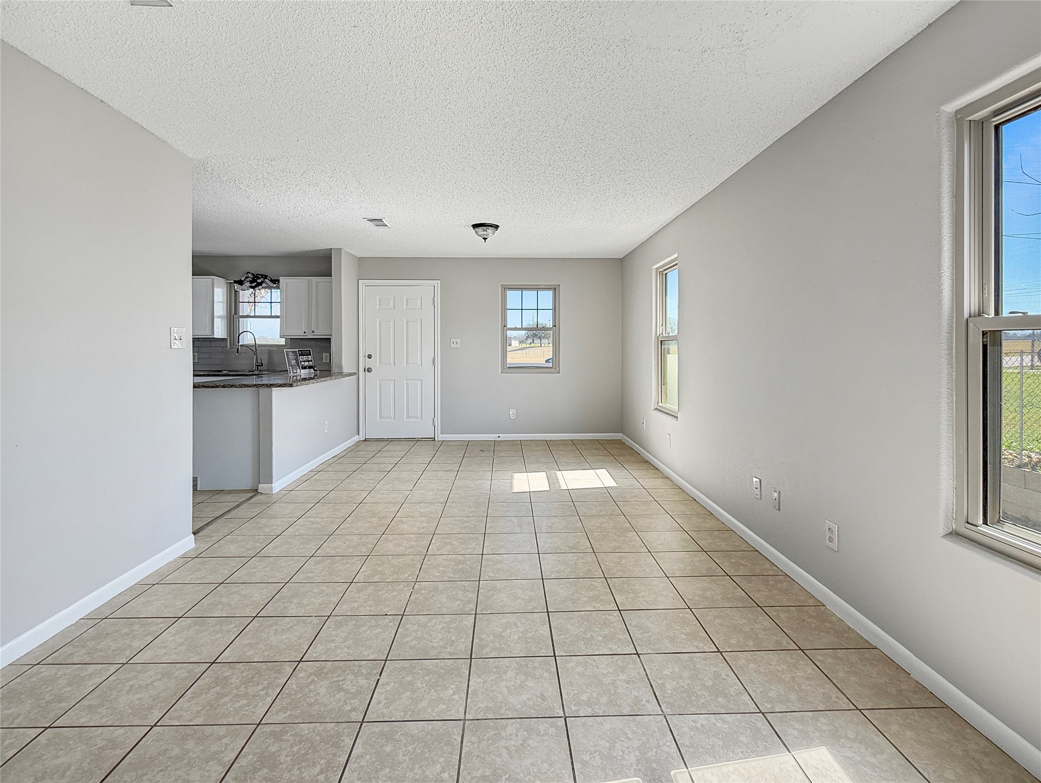 114 8th Street Rosenberg, TX 77471 - Photo 16 of 19 a view of empty room with windows