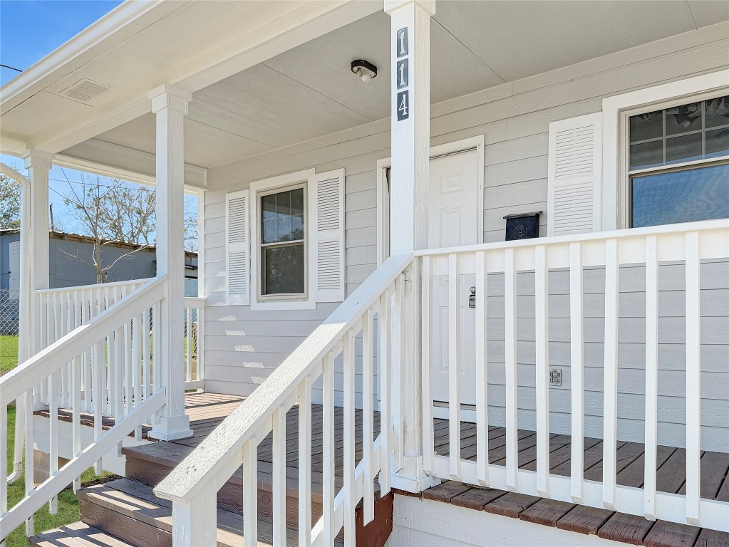 114 8th Street Rosenberg, TX 77471 - Photo 3 of 19 a view of balcony with wooden floor and fence