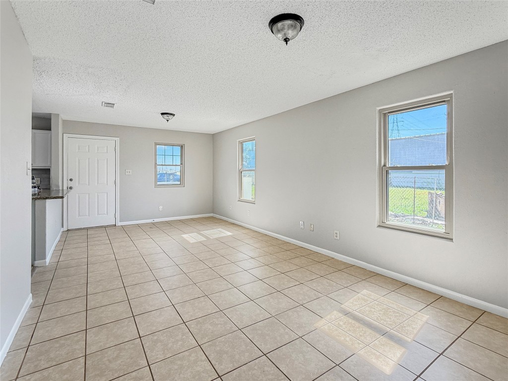 114 8th Street Rosenberg, TX 77471 - Photo 7 of 19 a view of an empty room and window