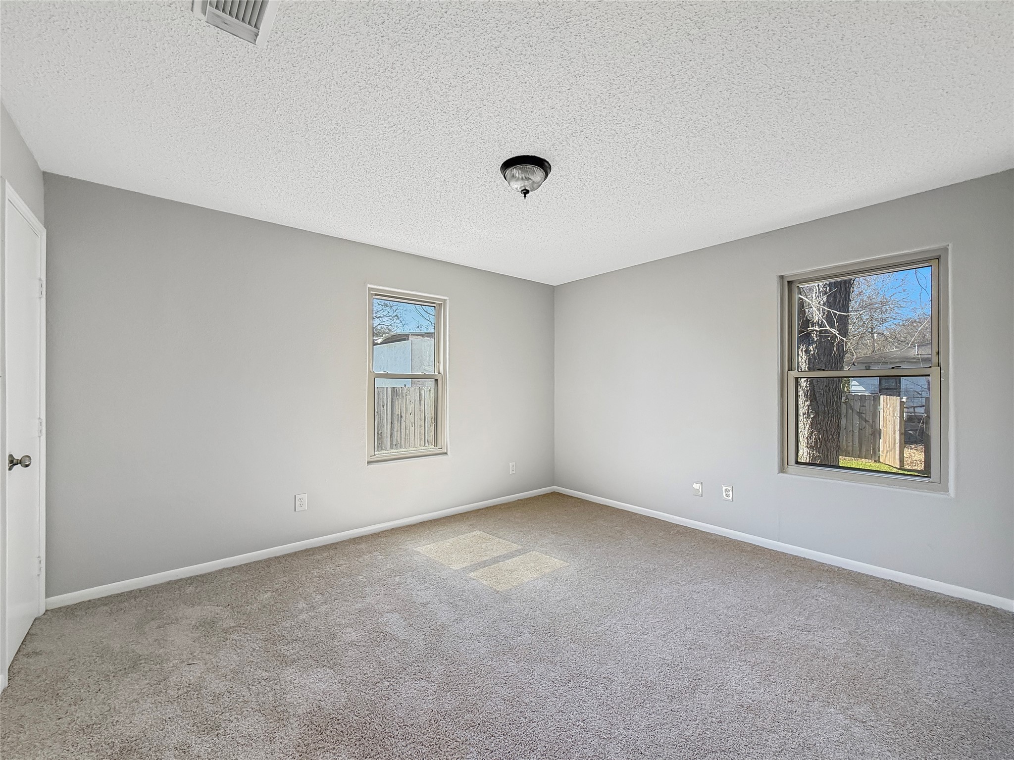 114 8th Street Rosenberg, TX 77471 - Photo 9 of 19 a view of an empty room with a window