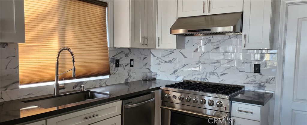 a kitchen with a stove and a microwave