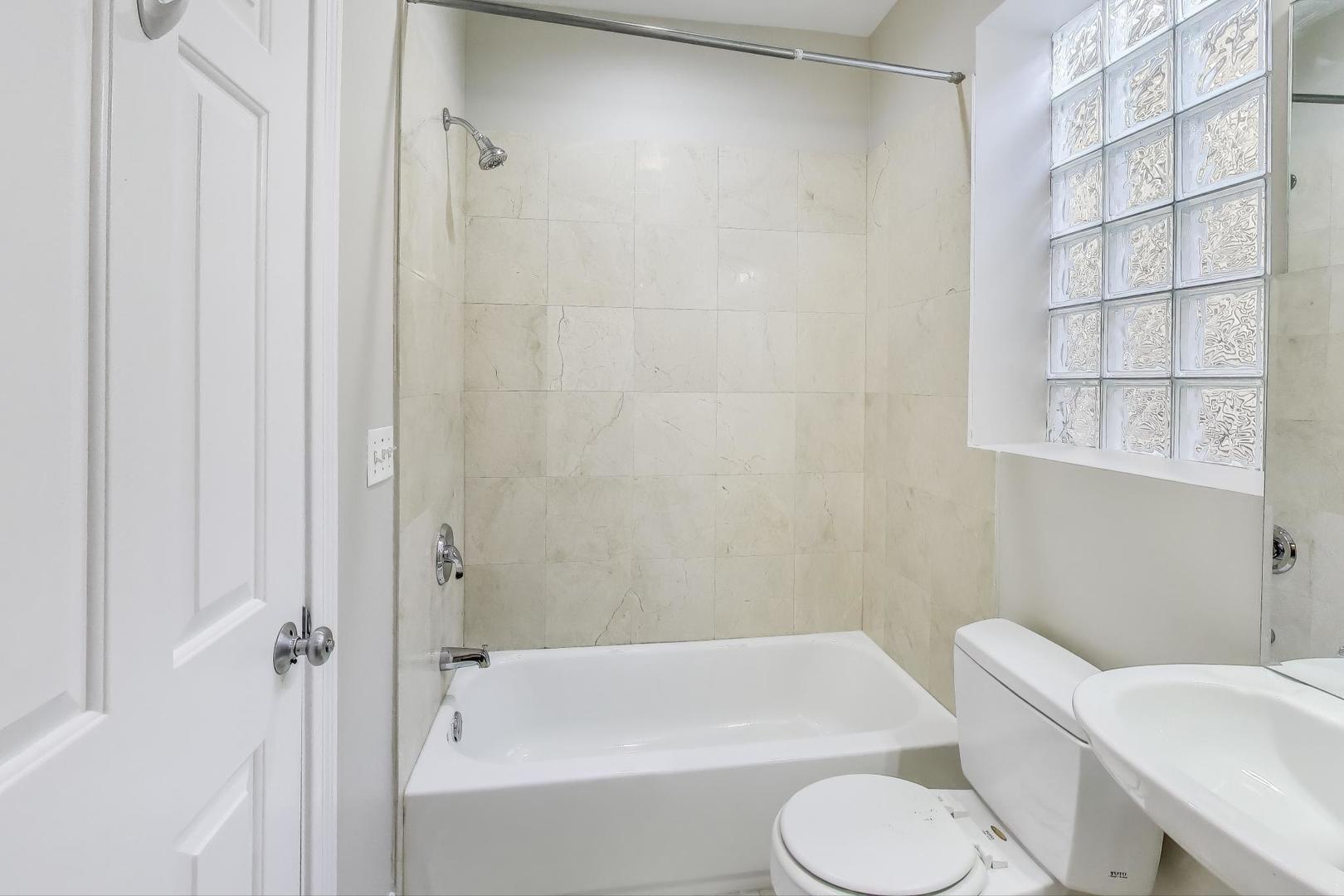1308 West Fillmore Street, Unit 3 Chicago, IL 60607 - Photo 20 of 23 a bathroom with a toilet and a bathtub