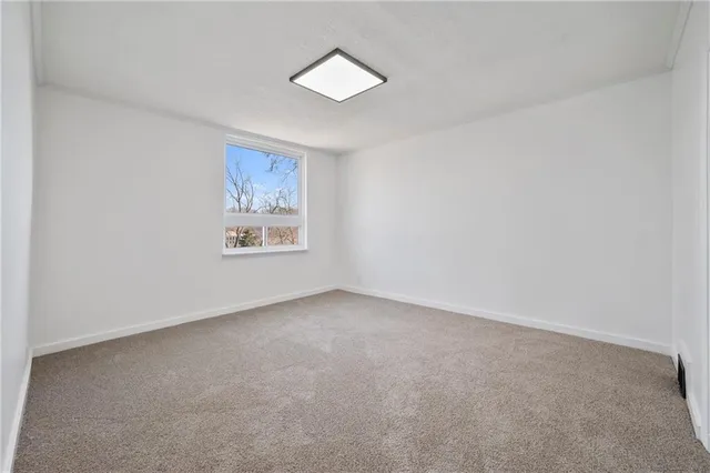 an empty room with windows and window