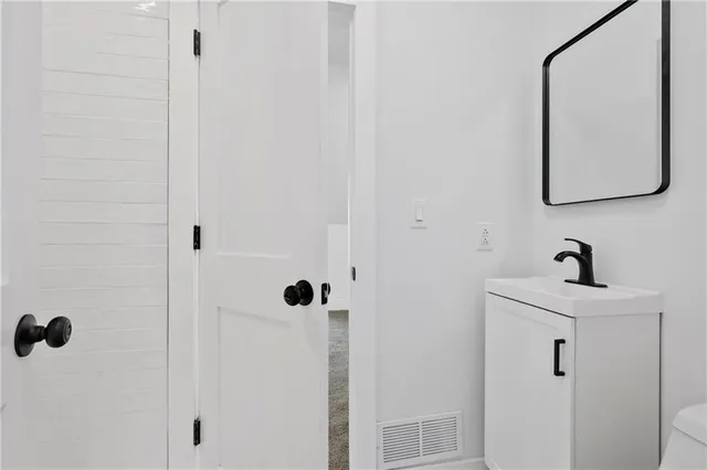 a bathroom with a sink and mirror