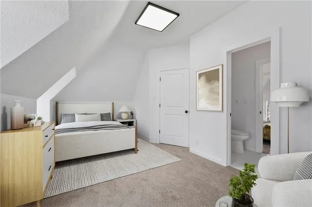 a view of a bedroom with a bed and cabinet