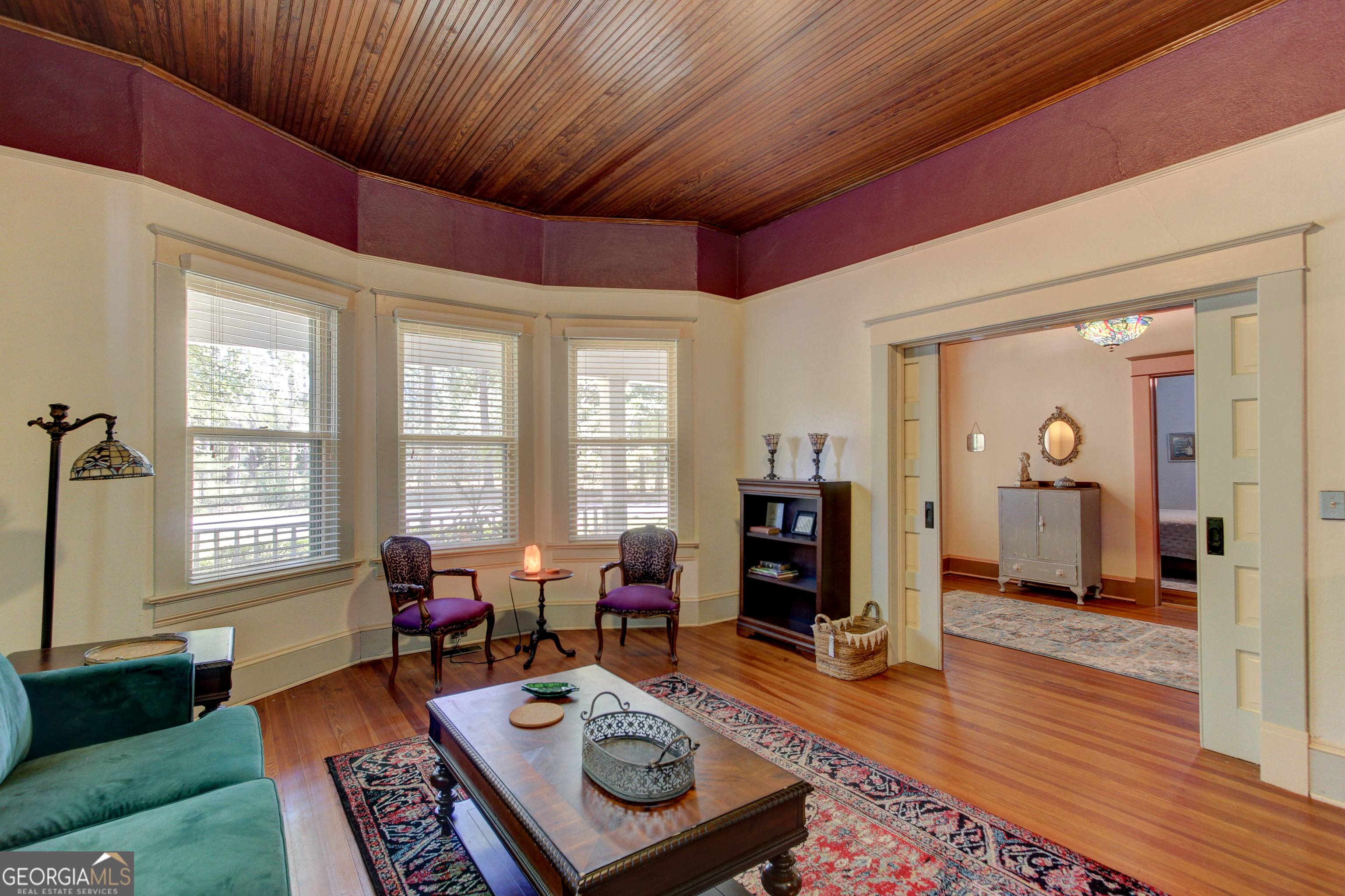 127 Wilkins Road Fayetteville, GA 30214 - Photo 11 of 53 a living room with furniture a wooden floor and a window