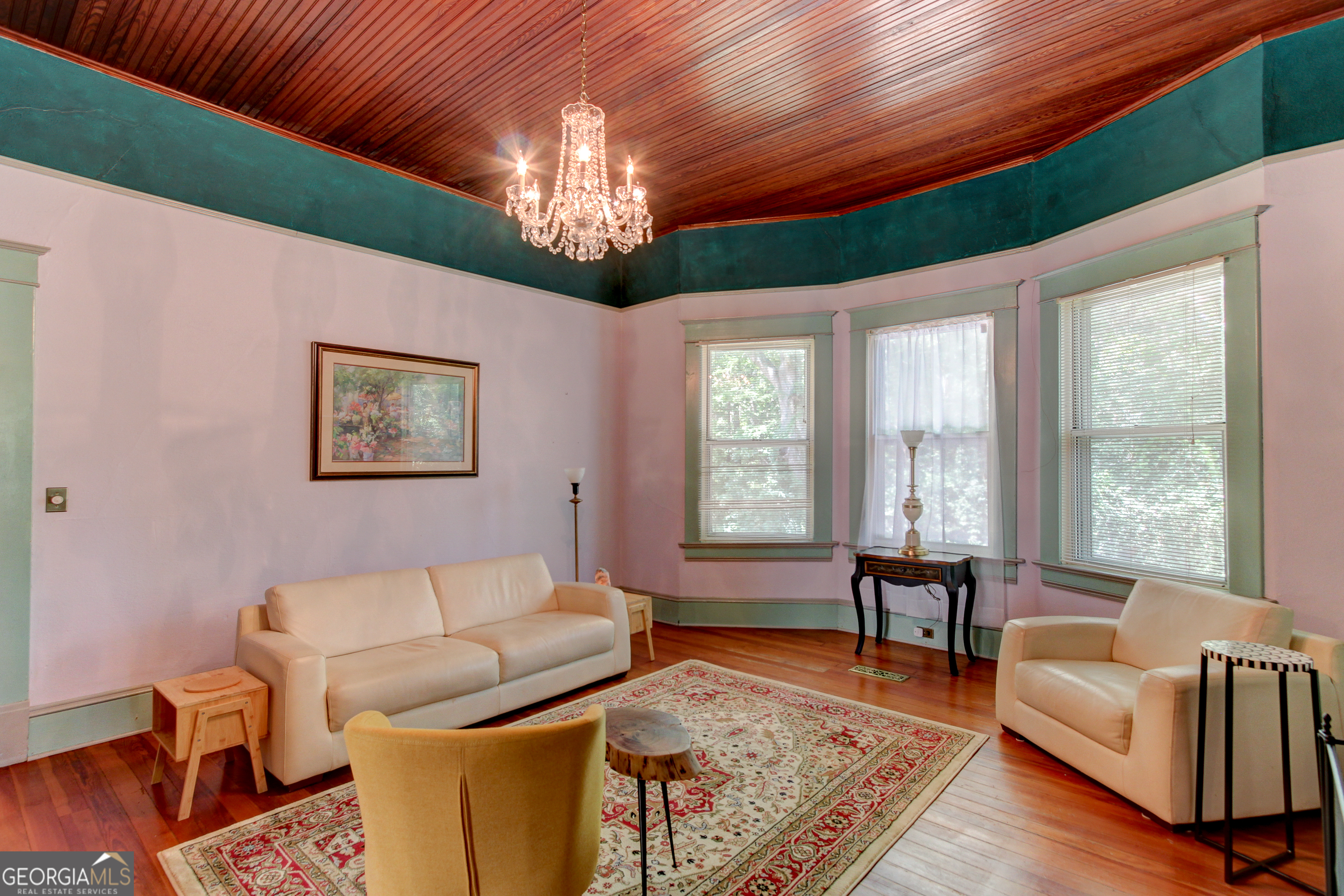 127 Wilkins Road Fayetteville, GA 30214 - Photo 13 of 53 a living room with furniture and a chandelier