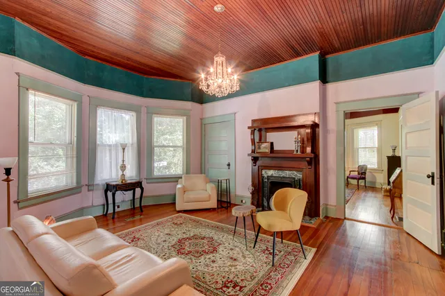 a living room with furniture and a fireplace