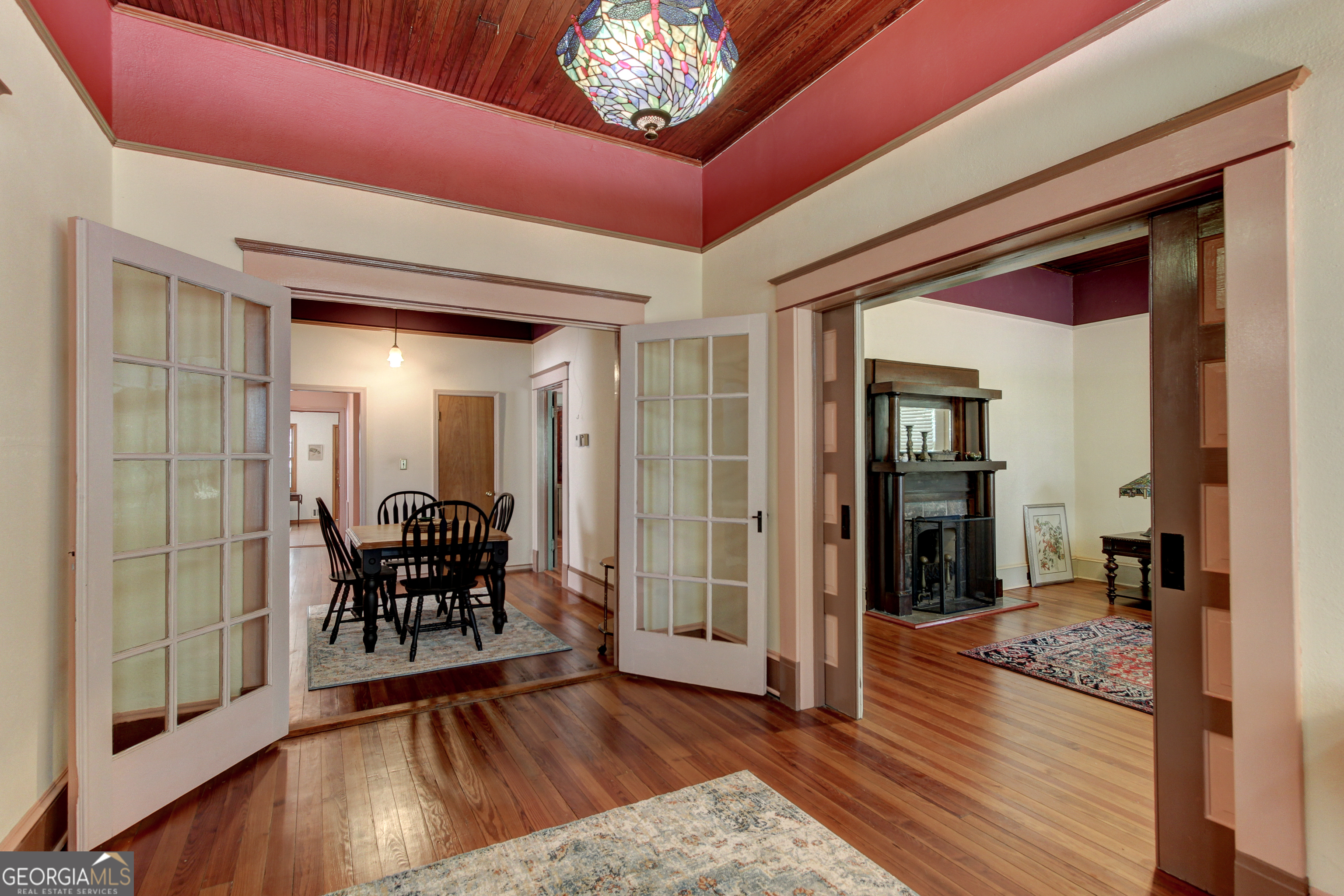 127 Wilkins Road Fayetteville, GA 30214 - Photo 2 of 53 a view of a hallway to dining room with furniture and wooden floor