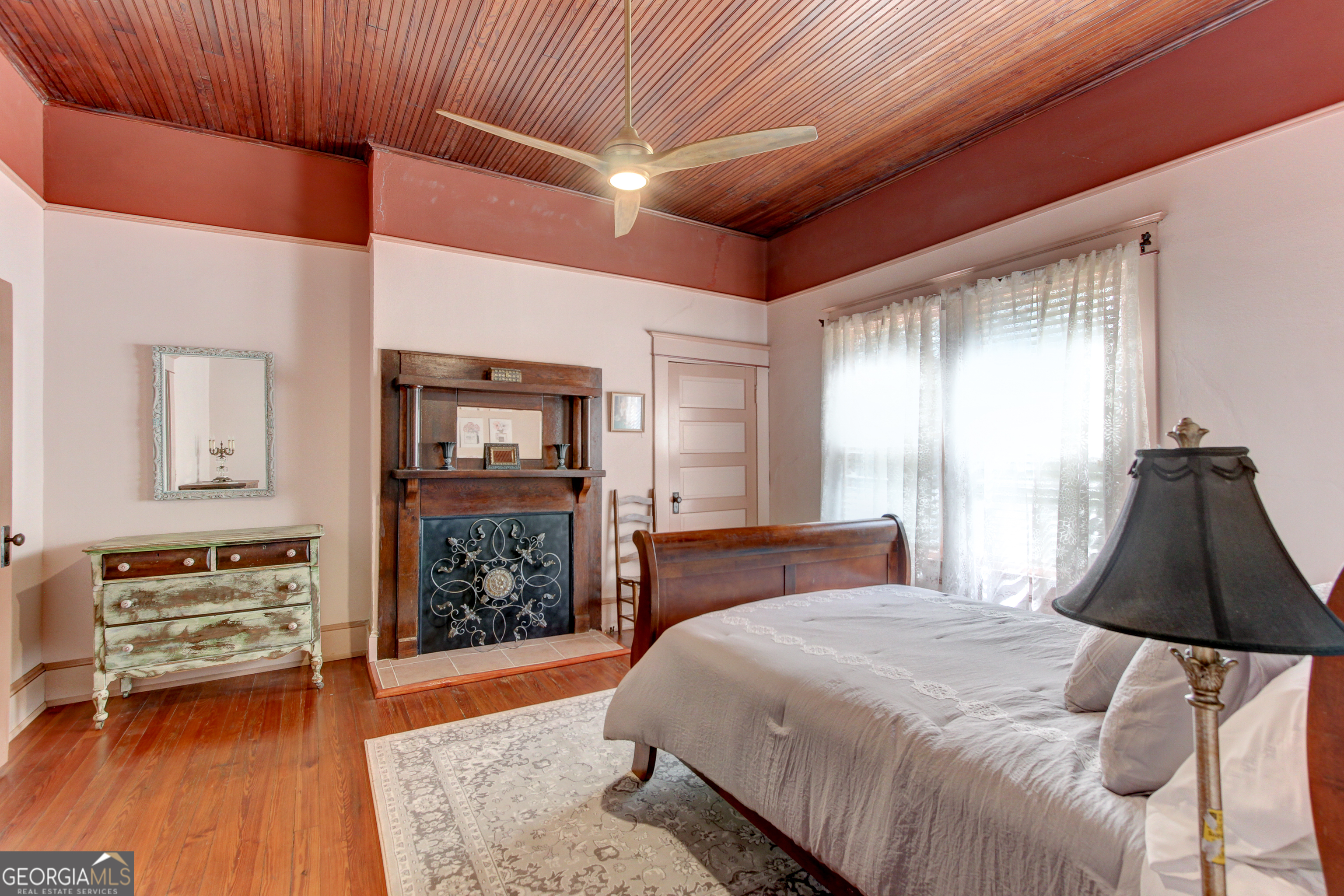 127 Wilkins Road Fayetteville, GA 30214 - Photo 23 of 53 a bedroom with a bed and wooden floor