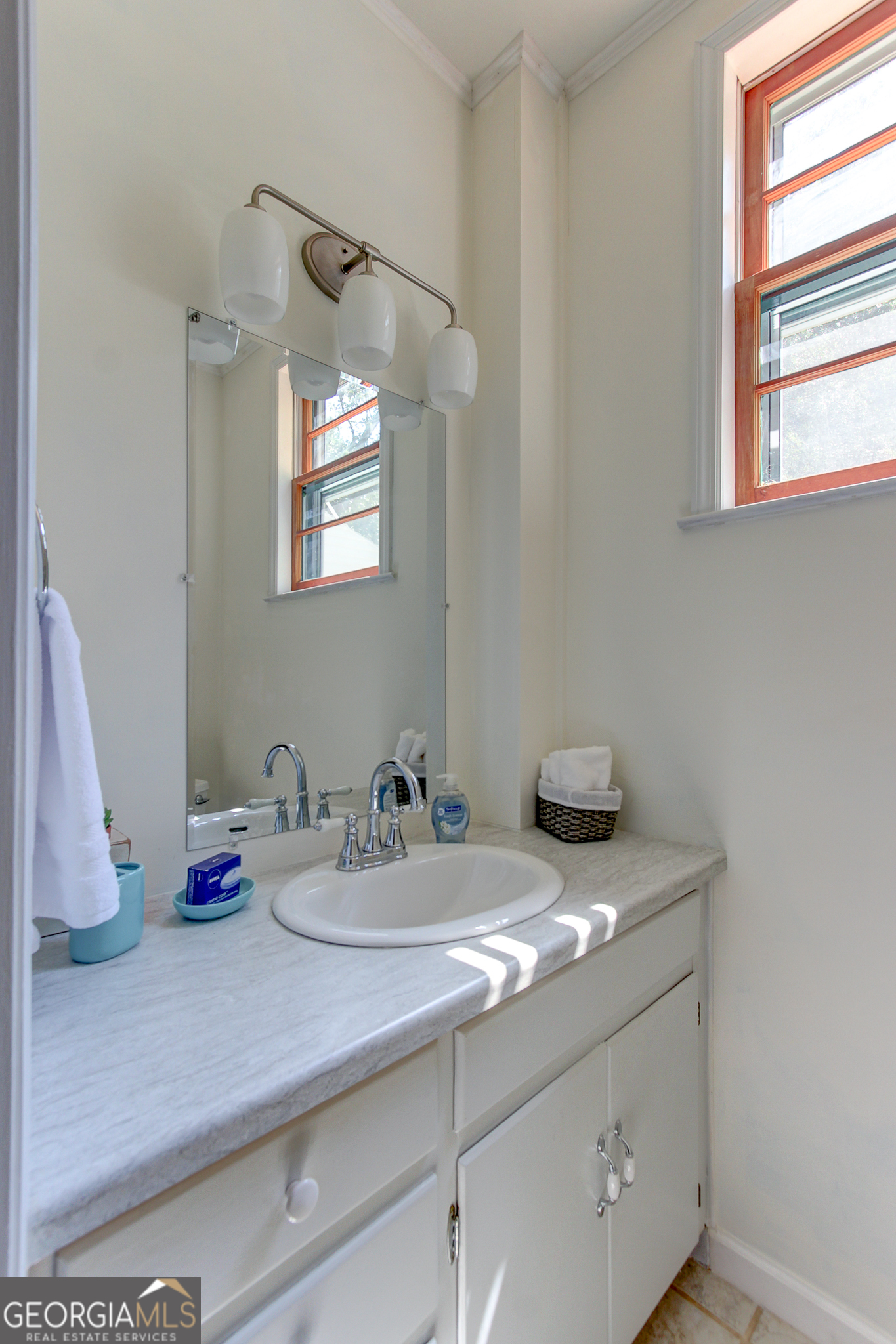 127 Wilkins Road Fayetteville, GA 30214 - Photo 25 of 53 a bathroom with a sink and a mirror