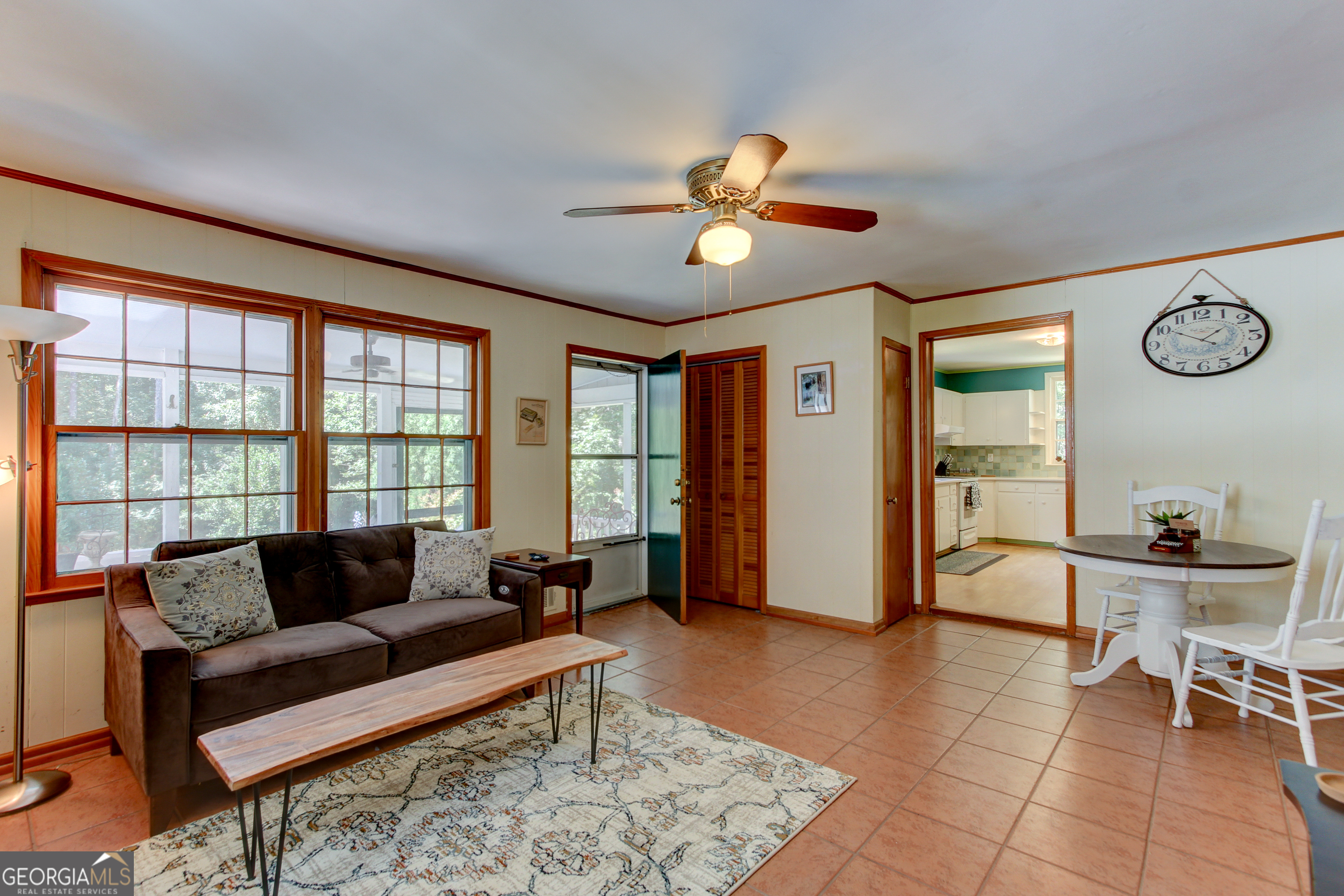 127 Wilkins Road Fayetteville, GA 30214 - Photo 31 of 53 a living room with furniture a dining table and a large window