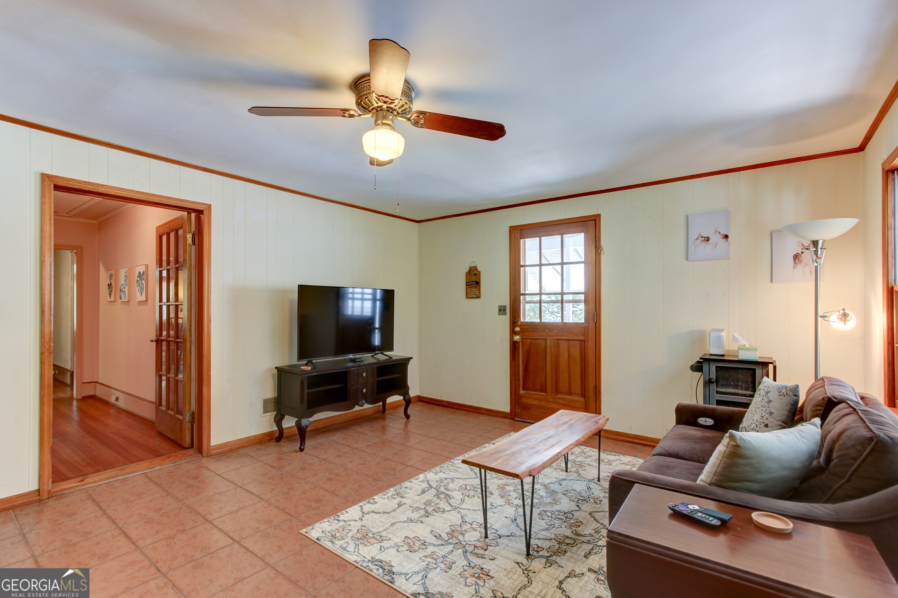 127 Wilkins Road Fayetteville, GA 30214 - Photo 32 of 53 a living room with furniture and a flat screen tv