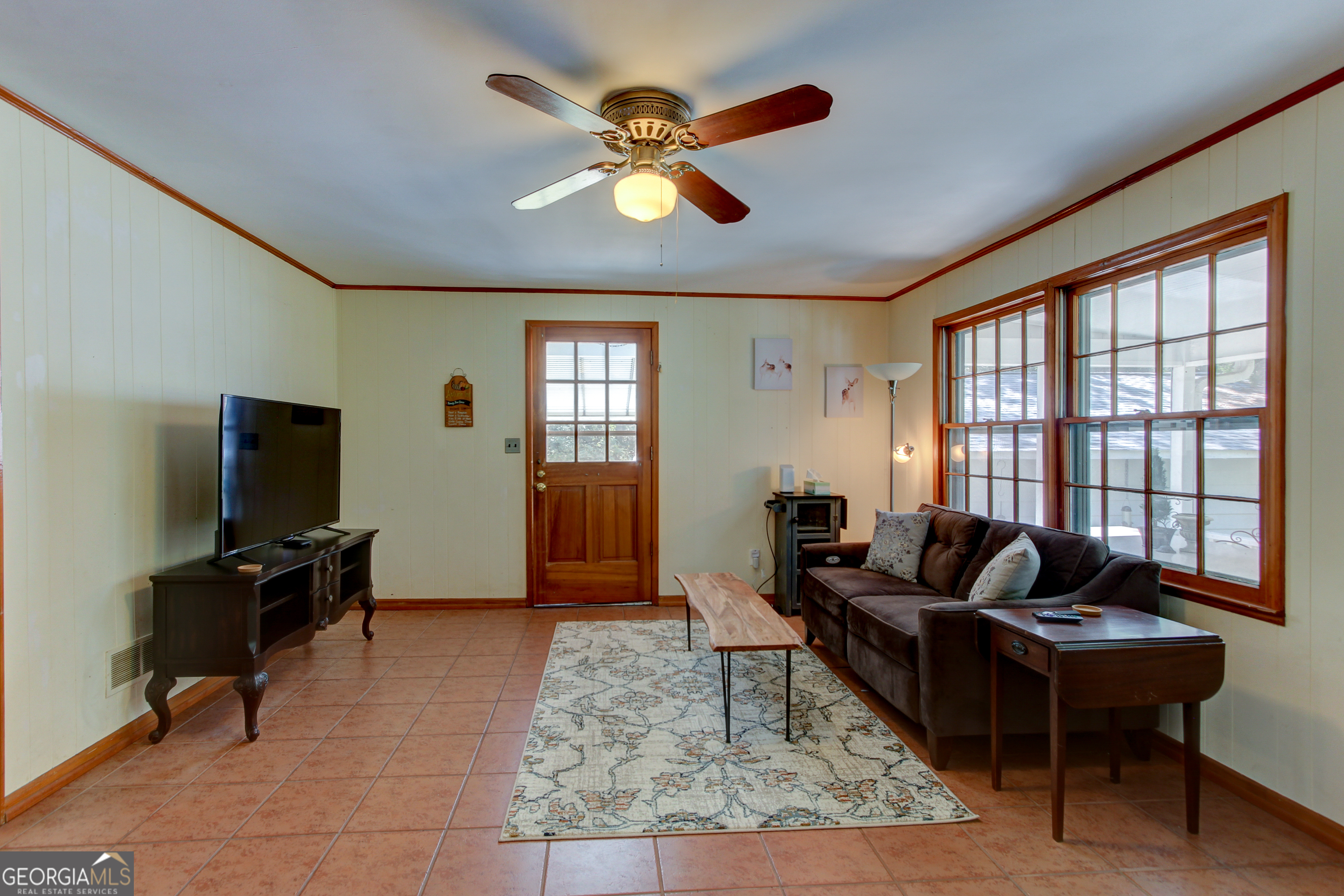 127 Wilkins Road Fayetteville, GA 30214 - Photo 33 of 53 a living room with furniture a ceiling fan and a window