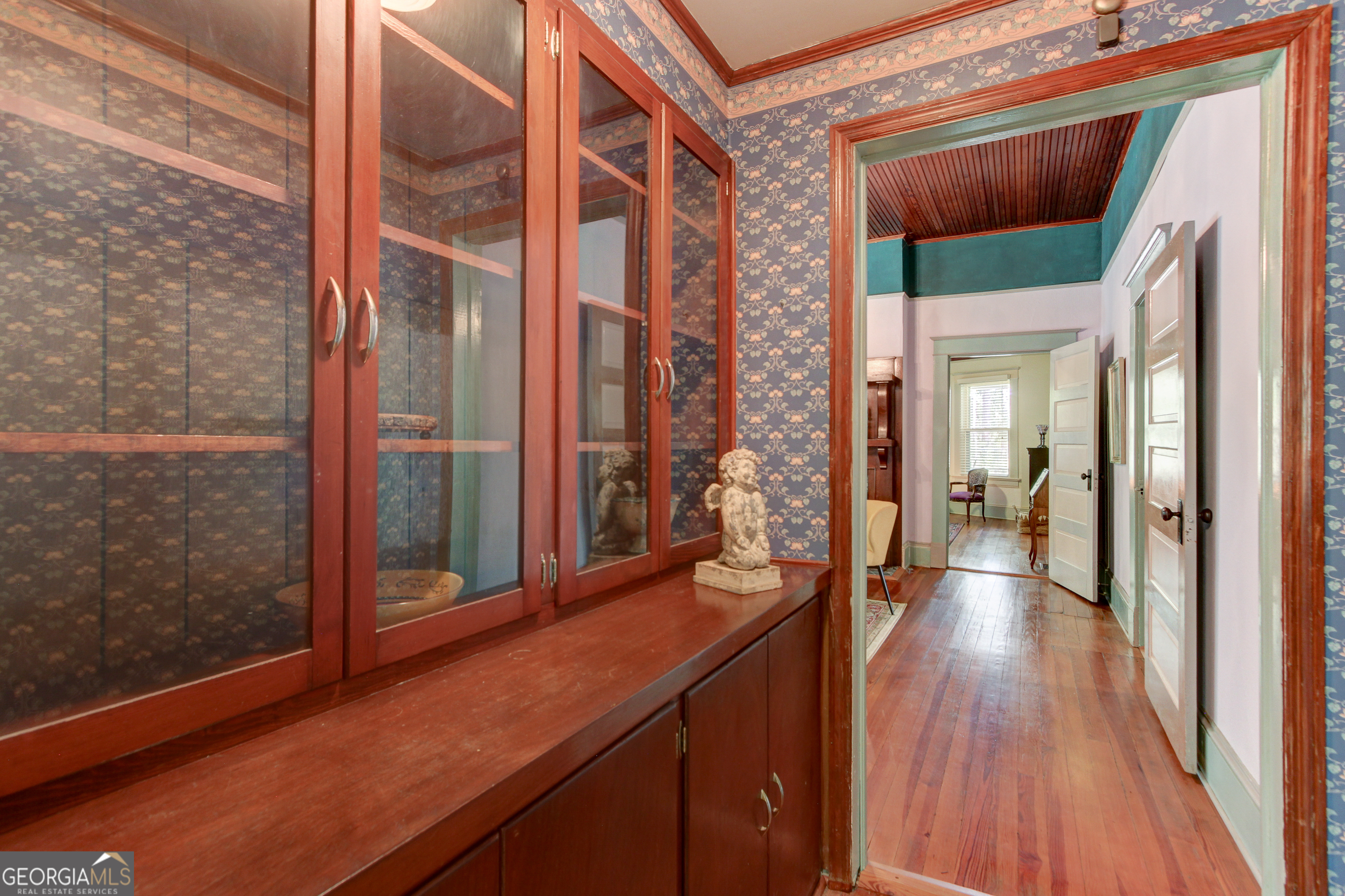 127 Wilkins Road Fayetteville, GA 30214 - Photo 39 of 53 a view of a hallway with wooden floor and glass door