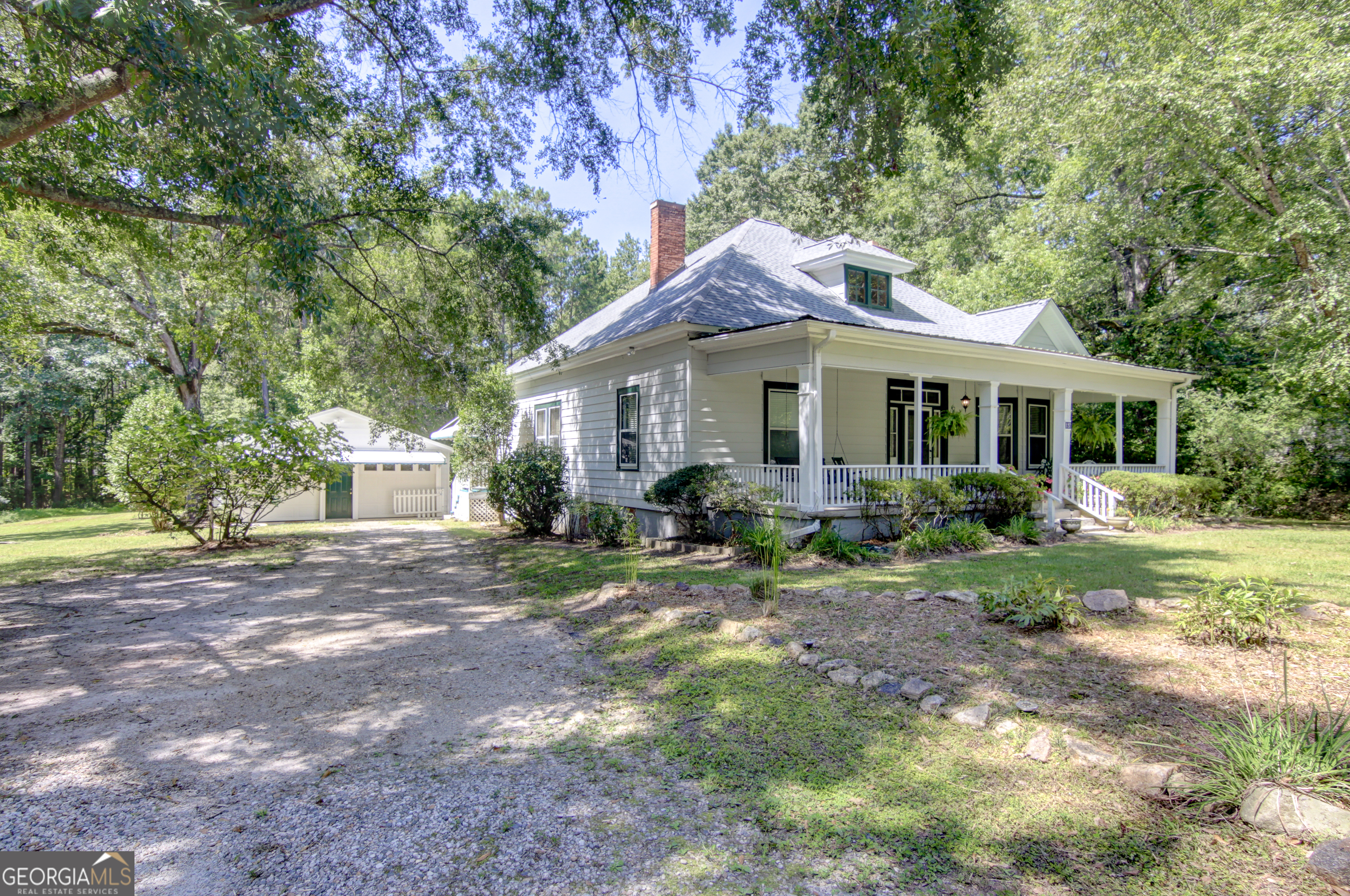 127 Wilkins Road Fayetteville, GA 30214 - Photo 46 of 53 a front view of a house with a garden