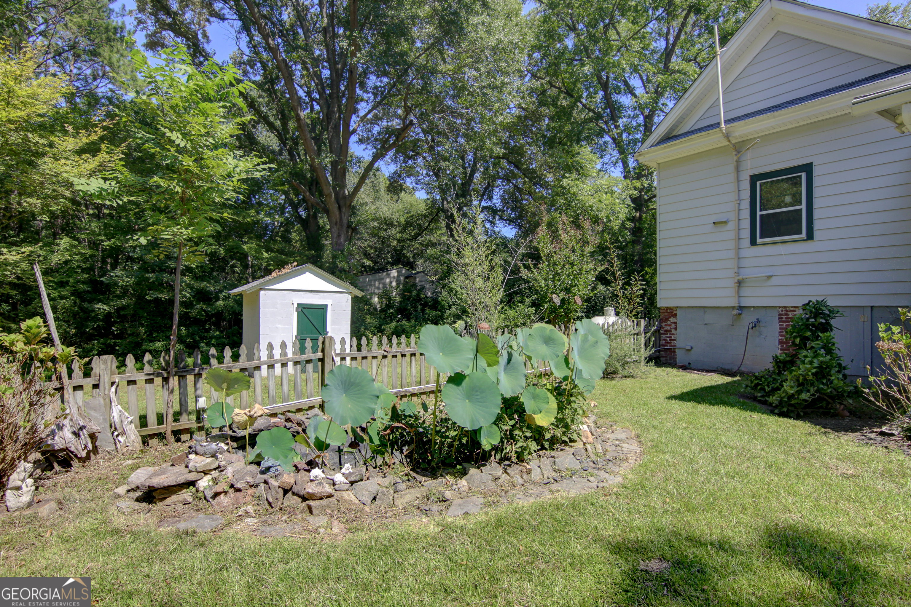 127 Wilkins Road Fayetteville, GA 30214 - Photo 52 of 53 a front view of a house with a yard