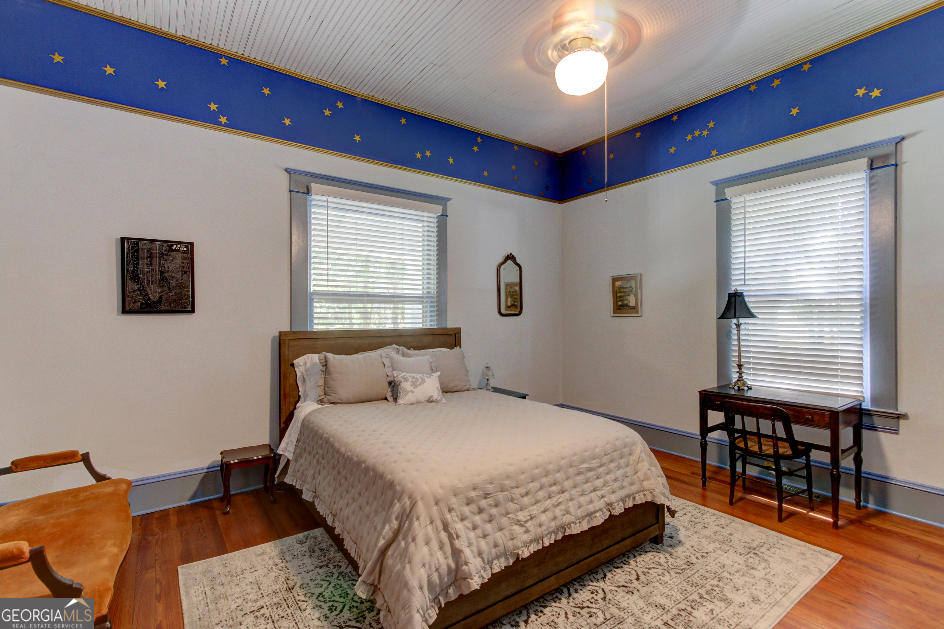 127 Wilkins Road Fayetteville, GA 30214 - Photo 6 of 53 a bedroom with a bed and a chandelier