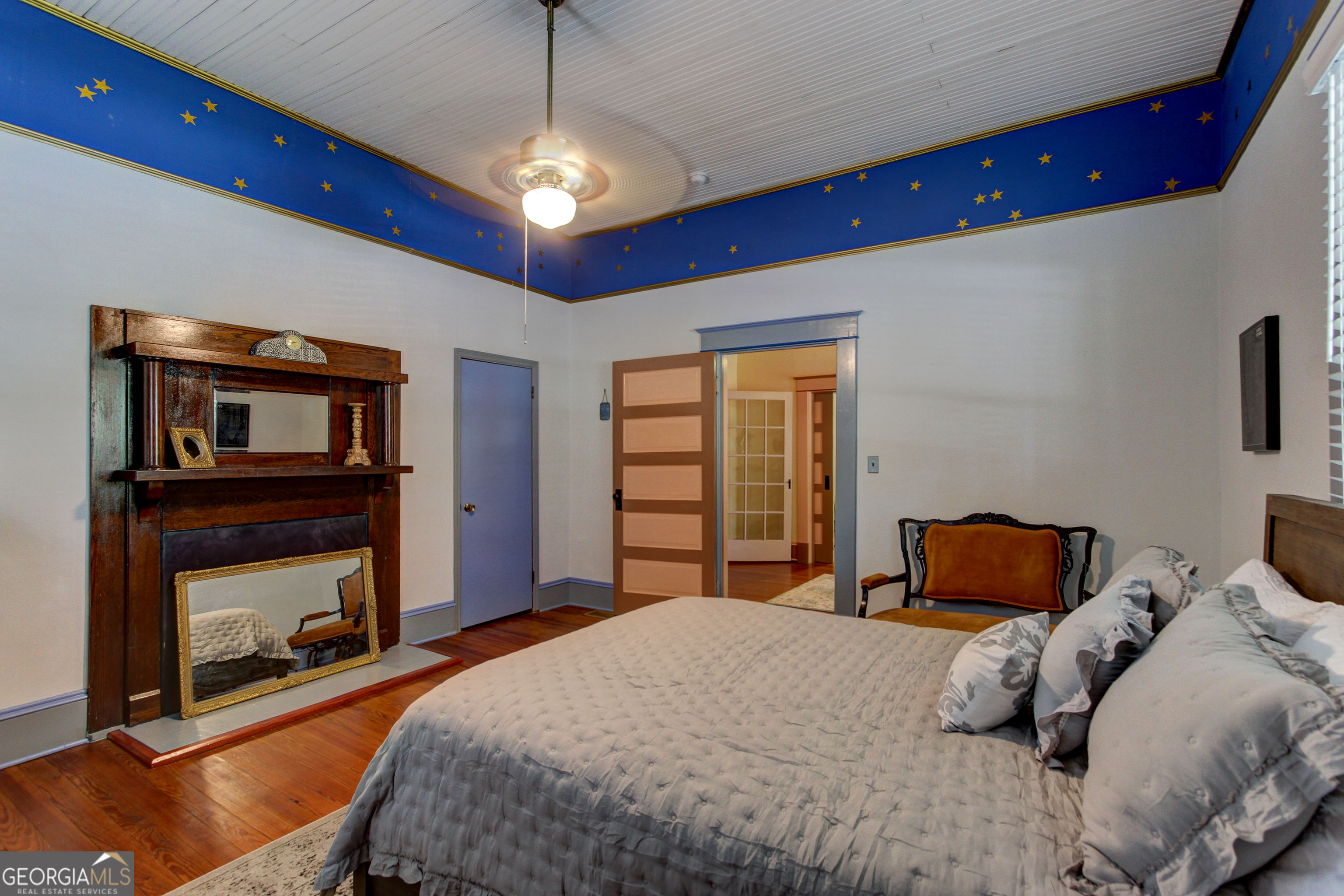 127 Wilkins Road Fayetteville, GA 30214 - Photo 7 of 53 a bedroom with a bed and a fireplace