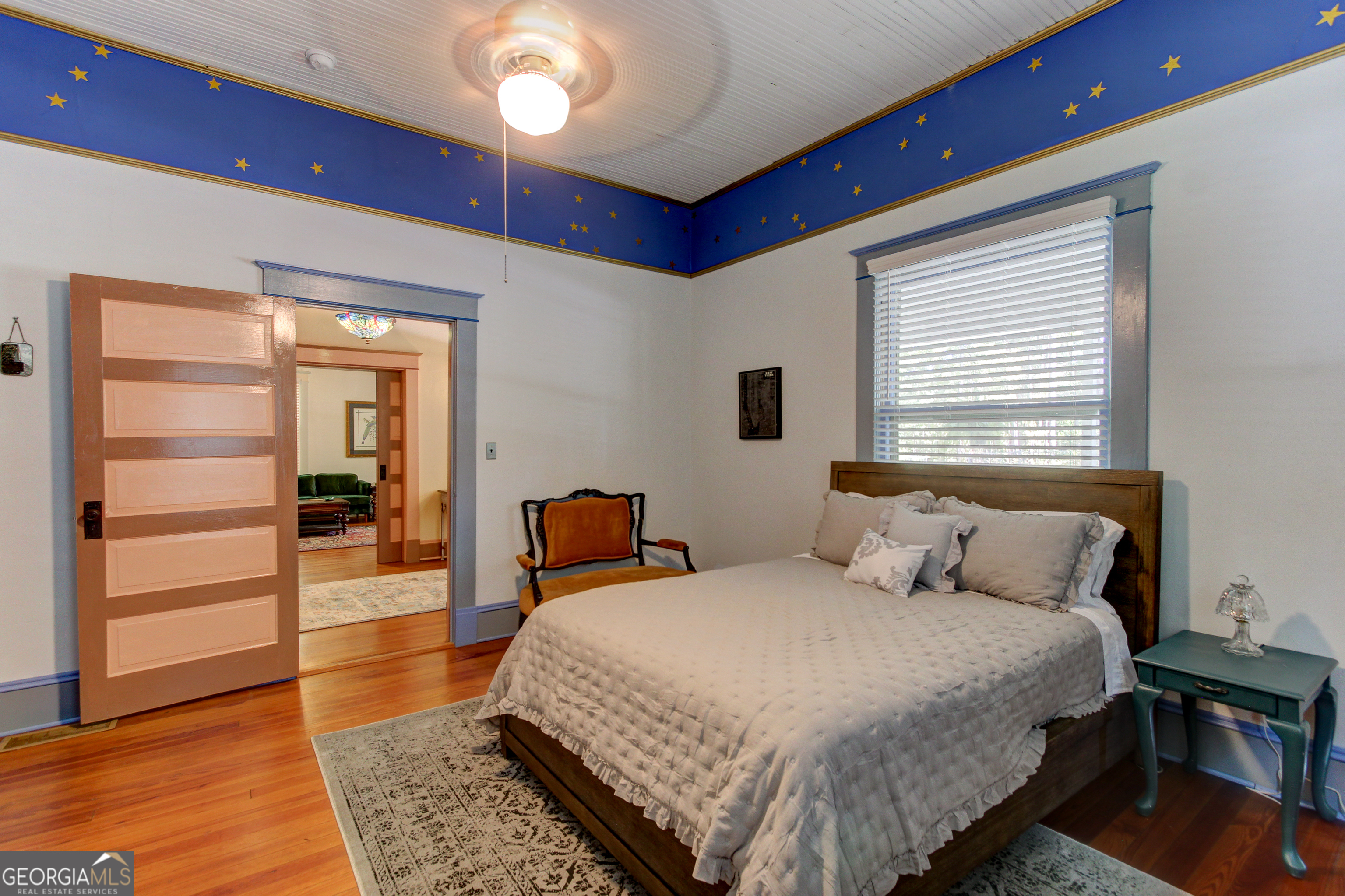 127 Wilkins Road Fayetteville, GA 30214 - Photo 8 of 53 a bedroom with a bed and wooden floor