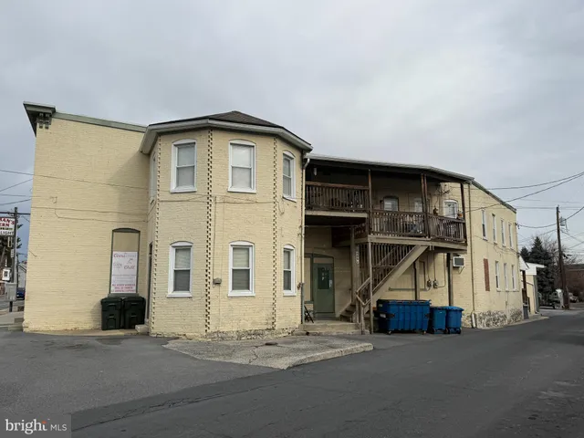 a view of a car park in front of a building