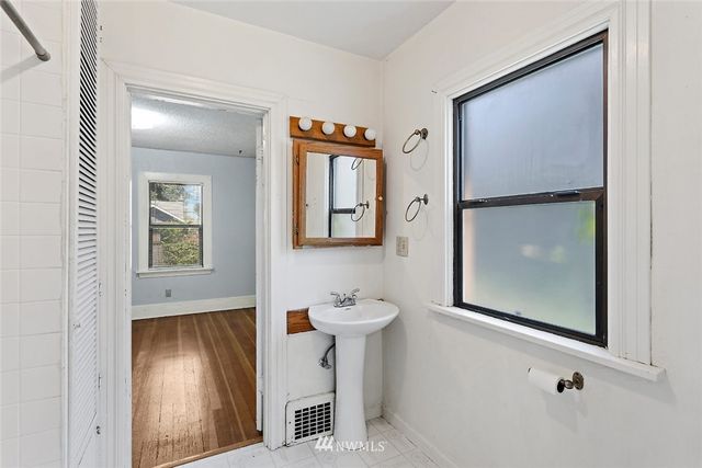a bathroom with a sink and mirror