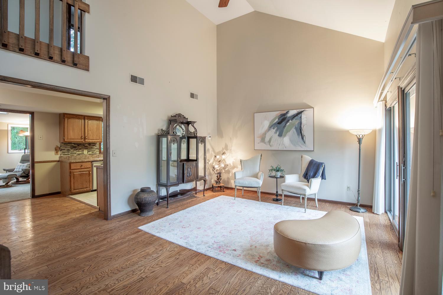 225 Pueblo Road Doylestown, PA 18901 - Photo 7 of 35 a living room with furniture and a wooden floor