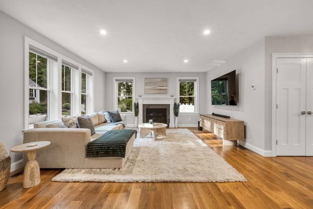 540 Pulaski Boulevard Bellingham, MA 02019 - Photo 12 of 42 a living room with furniture and a fireplace