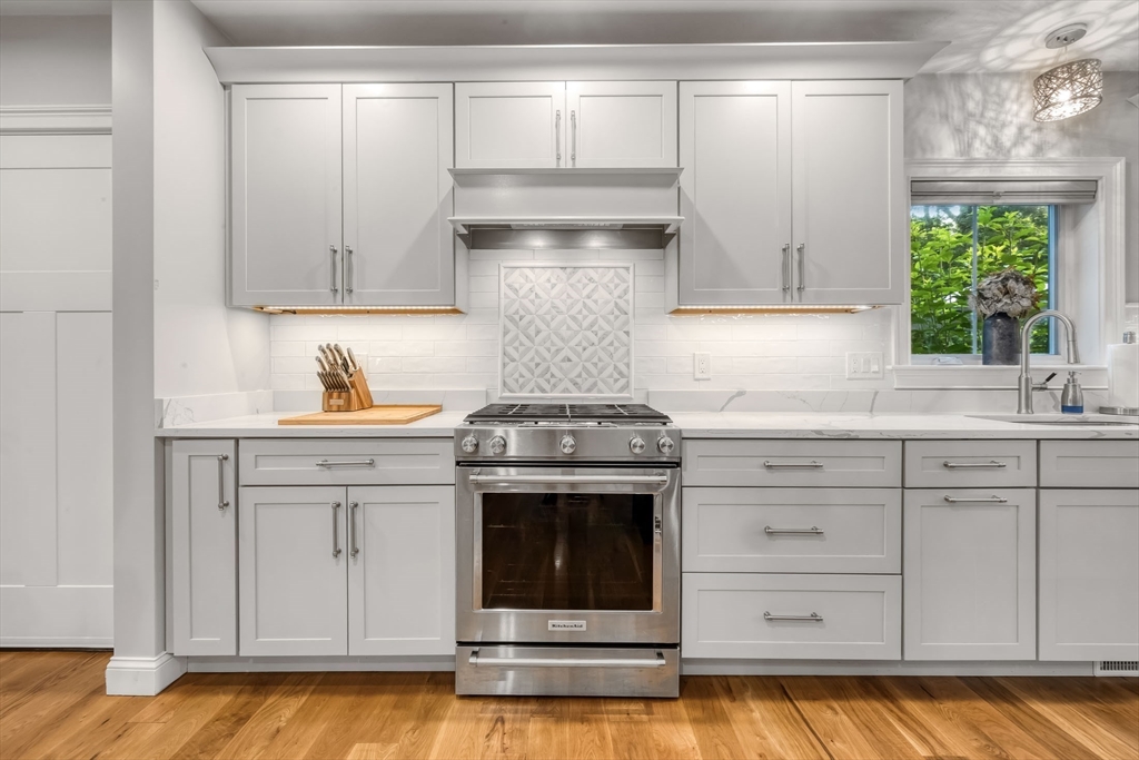 540 Pulaski Boulevard Bellingham, MA 02019 - Photo 18 of 42 a kitchen with stainless steel appliances granite countertop a sink and a stove