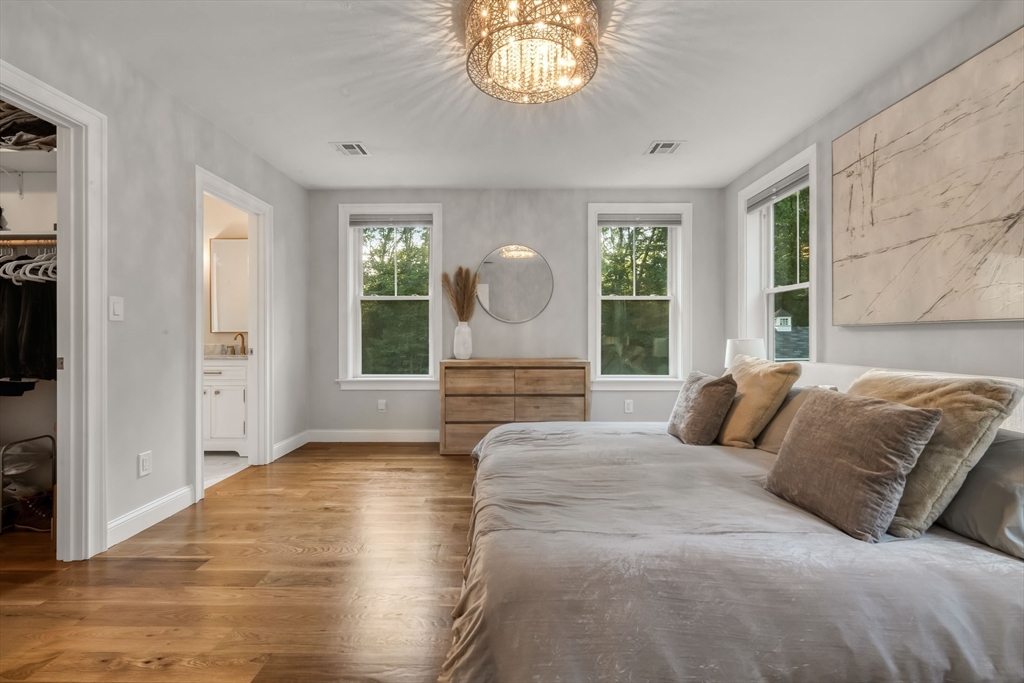 540 Pulaski Boulevard Bellingham, MA 02019 - Photo 22 of 42 a bedroom with a large bed and a large window