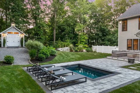 a view of backyard with seating space