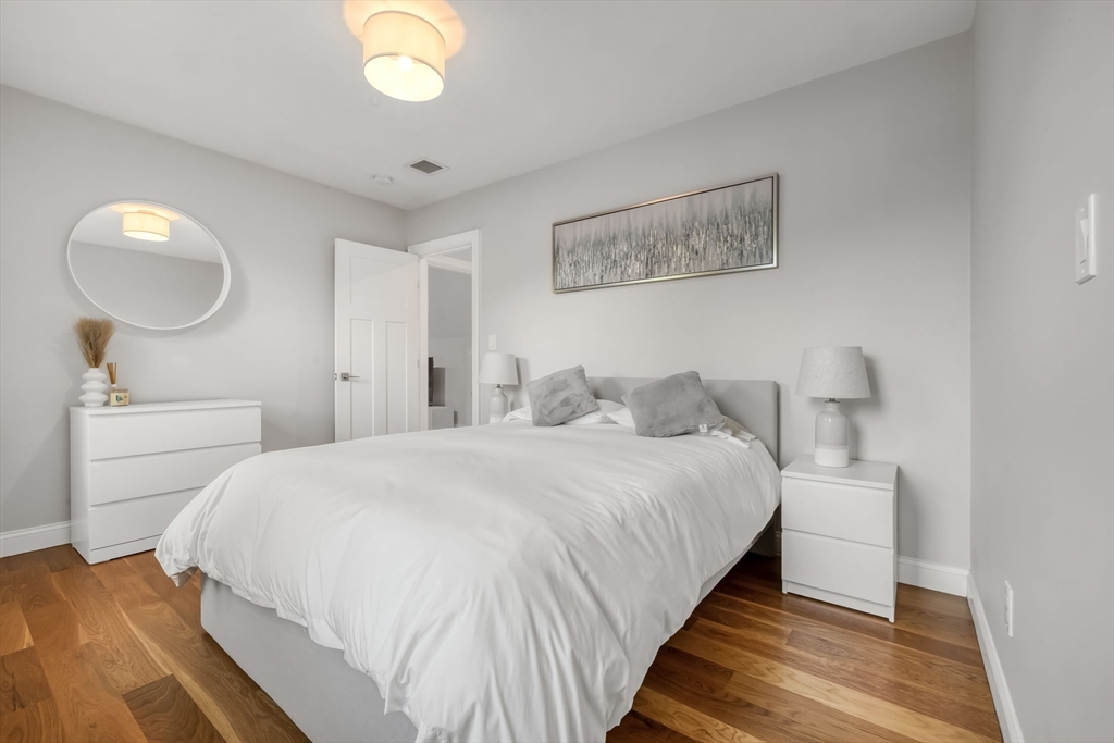 540 Pulaski Boulevard Bellingham, MA 02019 - Photo 31 of 42 a bedroom with bed and a mirror
