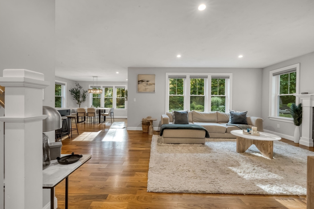 540 Pulaski Boulevard Bellingham, MA 02019 - Photo 10 of 42 a living room with fireplace furniture and a large window