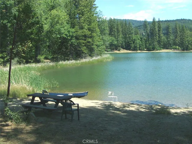 a view of a lake with a yard