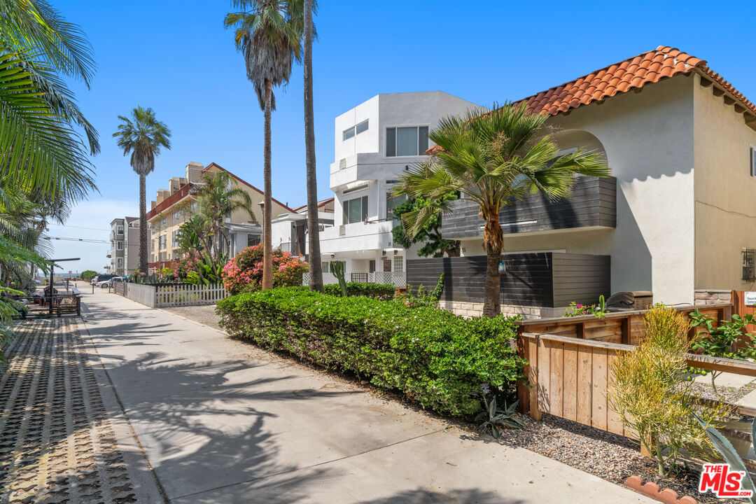 35 Catamaran Street, Unit 3 Marina del Rey, CA 90292 - Photo 1 of 11 a front view of a house with a yard and garage