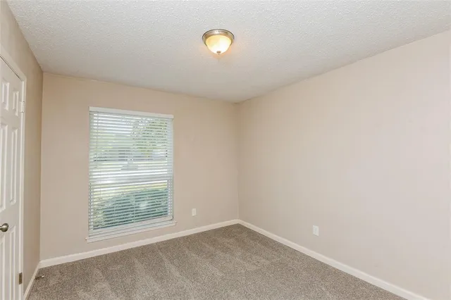 a view of a room that has a window in it