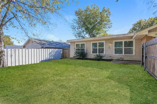 a view of a backyard with a garden